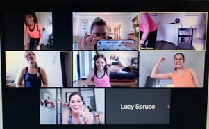 A group of people in front of a television

Description automatically generated