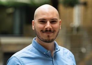 A person wearing a blue shirt
Description automatically generated