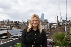 A person smiling for the camera

Description automatically generated